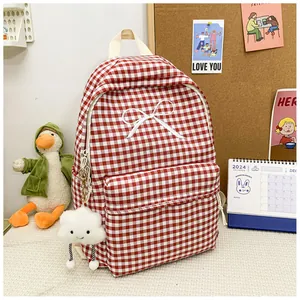Red and white checkered Japanese style schoolbag featuring white bow and cloud pendant