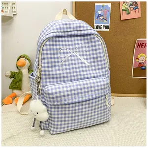 Blue gingham school backpack featuring white bow embroidery and a cute plush cloud keychain