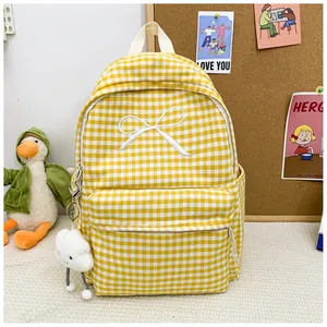 Yellow and white gingham school backpack with embroidered bow and duck plushie