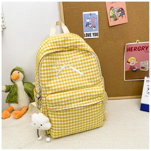 Yellow and white checkered backpack with white bow embroidery and cloud keychain