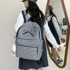 Japanese style black and white checkered backpack with bow detail and cloud charm