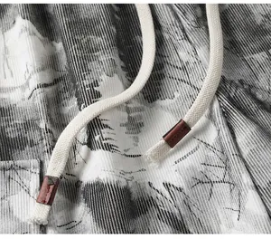 Close-up of drawstring and textured tie-dye fabric on vintage men casual shorts
