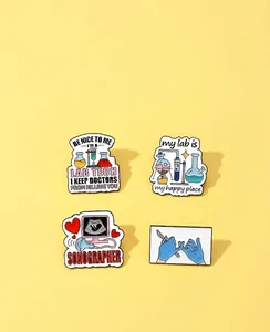 Detailed view of medical enamel pins featuring lab tech and sonographer designs