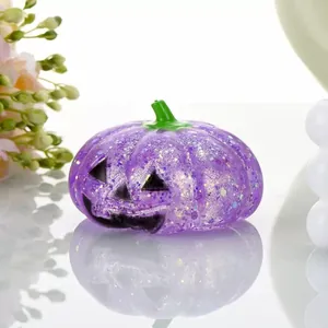 Detailed macro view of a purple glittery Halloween pumpkin squishy stress relief toy