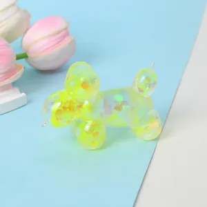 Translucent yellow balloon dog squeeze toy with iridescent sequins for stress relief