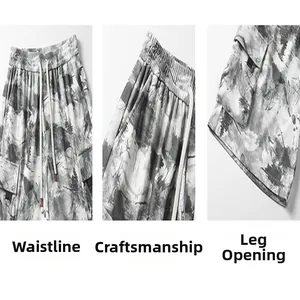 Detail view of men's tie-dye cargo shorts showing waistband and fabric texture.