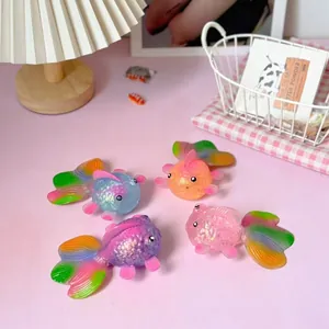 Detailed view of translucent colorful goldfish squeeze toys with glitter