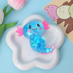 Cute blue translucent axolotl squeeze toy with glitter for stress relief on star tray