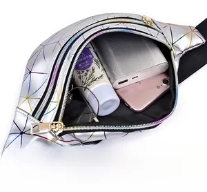 Macro view of holographic waist bag showing interior storage capacity for phone and power bank