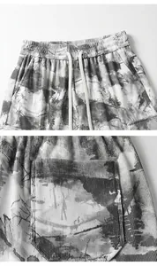 Detail shot of tie-dye retro men's casual shorts showing elastic waist and pocket.