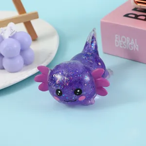 Close-up of purple glitter axolotl squishy toy with adorable cartoon face expression