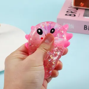 Pink glitter axolotl squishy toy made of TPR for stress relief and fun