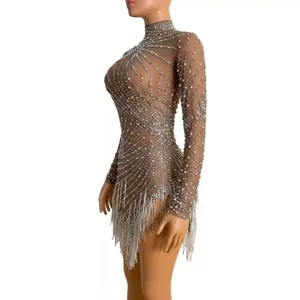 Sexy nude mesh mini dress with rhinestones and silver tassels for stage performances.