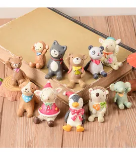 Collection of cute resin animal figurines looking up for home and garden decor details
