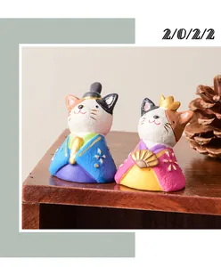Close-up detail of a pair of cute cat resin figurines for home and garden decoration