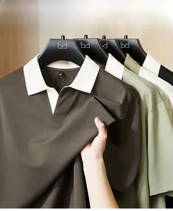 Detail of short-sleeve Polo shirt with contrast collar and smooth fabric texture