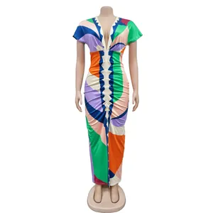 Vibrant abstract geometric print V-neck maxi dress with pleated front detail and slit.