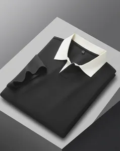 Detail shot of a black men's 40s cotton Polo shirt with a white ribbed collar.