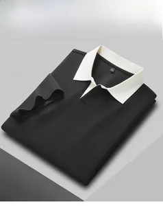 Detail shot of a black men's 40s cotton Polo shirt with a white ribbed collar.