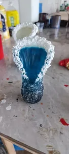Macro detail of creative wave vase with blue ocean resin and white foam sea texture