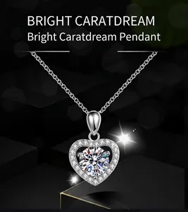 Detailed close-up of heart-shaped faux moissanite pendant with a sparkling diamond halo