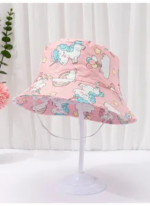 Close-up detail of infant pink bucket hat with whimsical unicorn and rainbow prints