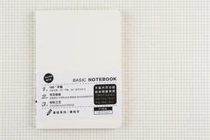 Detailed view of minimalist white A5 notebook featuring a 180-degree lay-flat design layout