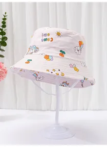 Detailed view of kids pink bucket hat with cute cartoon unicorn and cloud prints