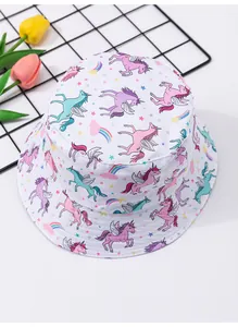 Detailed view of children's white bucket hat with colorful unicorn and rainbow print