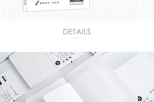 Close-up detail of white minimalist thread-bound notebook showing grid and blank inner pages