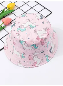 Detailed view of a pink children's bucket hat featuring cute unicorn pattern prints