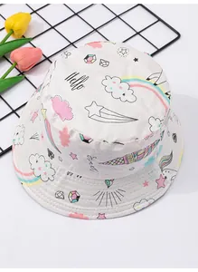 Detailed macro view of baby bucket hat featuring colorful unicorn and rainbow print design