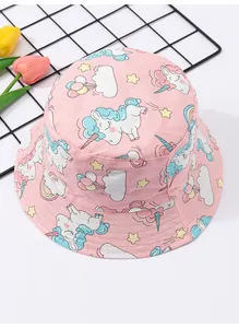 Close-up of pink baby bucket hat featuring adorable cartoon unicorn and rainbow patterns