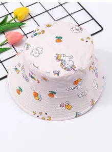 Macro view of children's pink bucket hat with cute unicorn and star print patterns