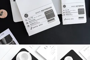 Detailed view of minimalist white notebook with product feature band and size specs