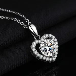 Elegant heart-shaped pendant necklace featuring a sparkling round moissanite stone