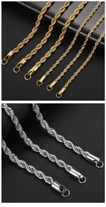 Macro view of gold and silver stainless steel rope chains showing fine twisted texture.