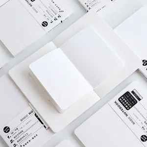 Minimalist white A5 grid notebook refill featuring a 180-degree flat-lay thread-bound design