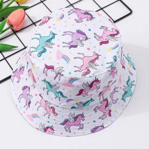 White baby bucket hat with unicorn and rainbow print for sun protection