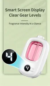 Close-up of smart digital display on white automatic aroma diffuser with pink oil