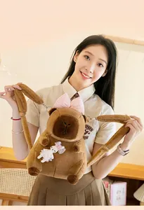 Detailed macro shot of a plush capybara backpack with cute bunny decoration and bow