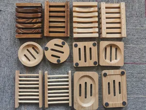 Collection of various natural bamboo and charred wooden soap dishes in multiple designs
