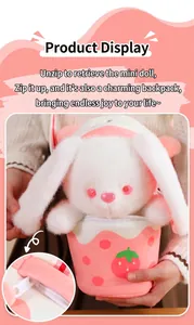 Close-up of detachable plush rabbit doll and functional zipper on strawberry bag