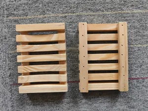 Natural wooden soap dish set showing front and back views on textured background
