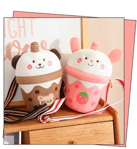 Close-up of cute milk tea cup shaped plush crossbody bags for girls in pink and brown.