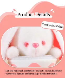 Macro view of the soft fabric and cute pink eyes on the white plush rabbit toy