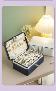 Premium double-layer jewelry storage organizer with necklaces and rings in soft velvet.