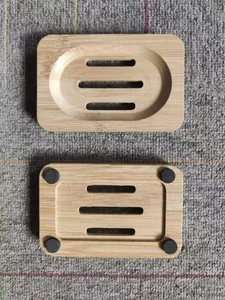 Top and bottom macro view of a natural bamboo soap dish with drainage slots and anti-slip pads