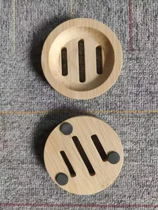 Detail view showing front and back of round bamboo soap dish with drainage slots