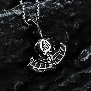 Macro detail of a vintage Viking Thor's Hammer necklace pendant with Valknut symbol
